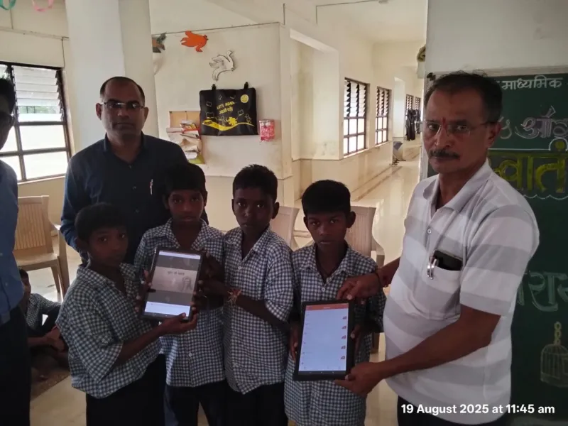 Students receiving EduSoulX tablets